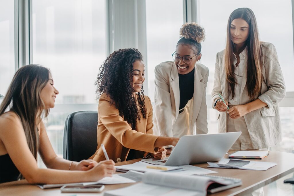 A group of women working together in an office.