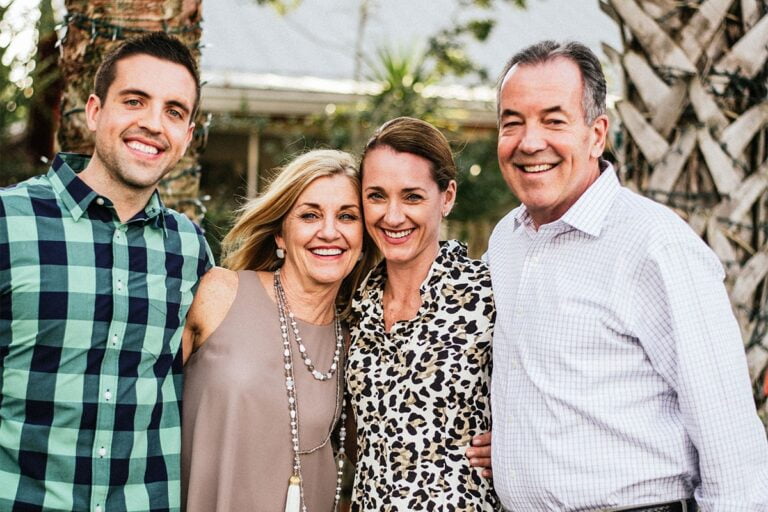 A family of four with adult children.